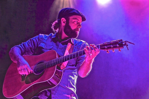 Main Playing Guitar on Stage